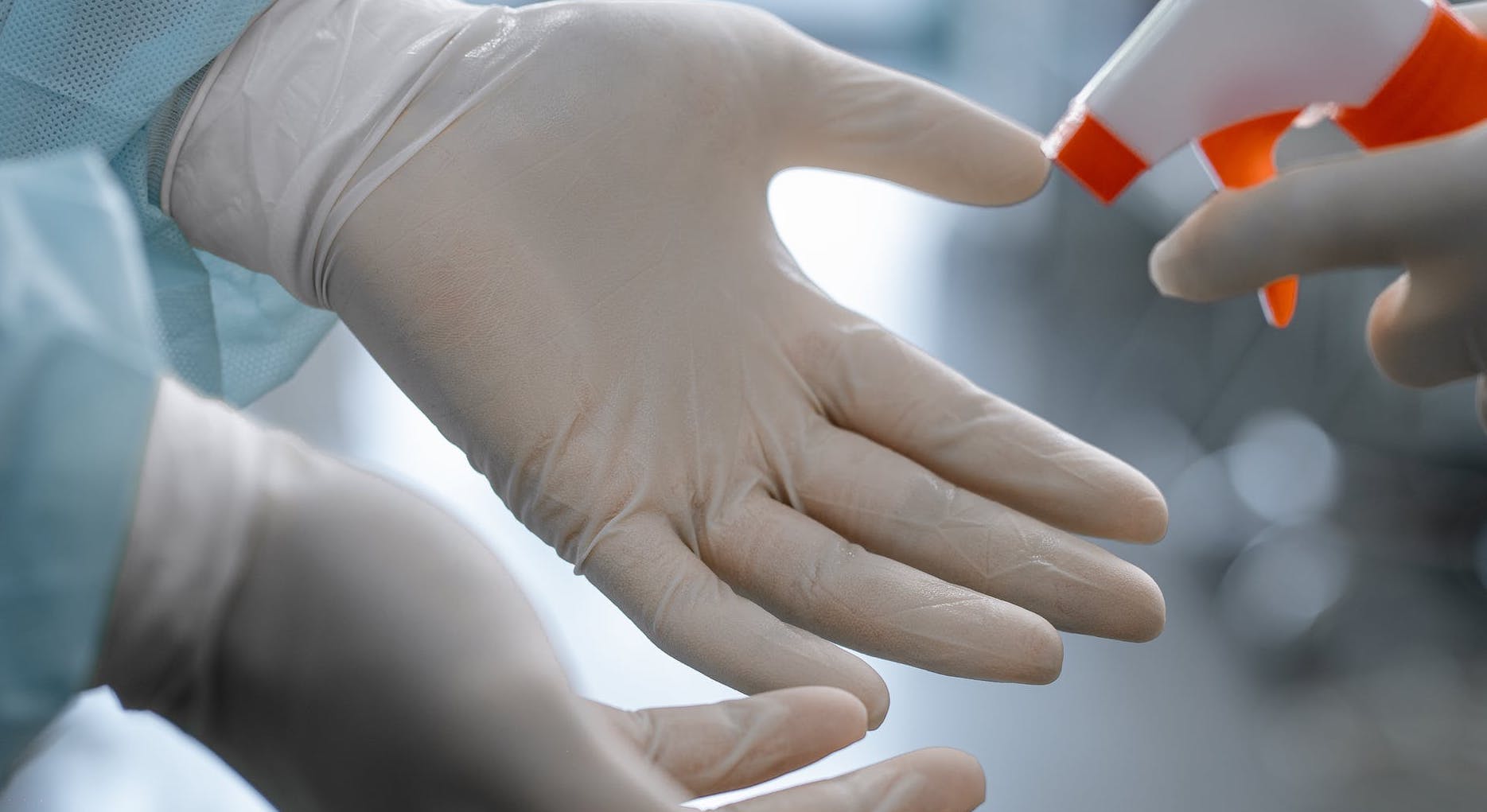 Two hands in medical gloves